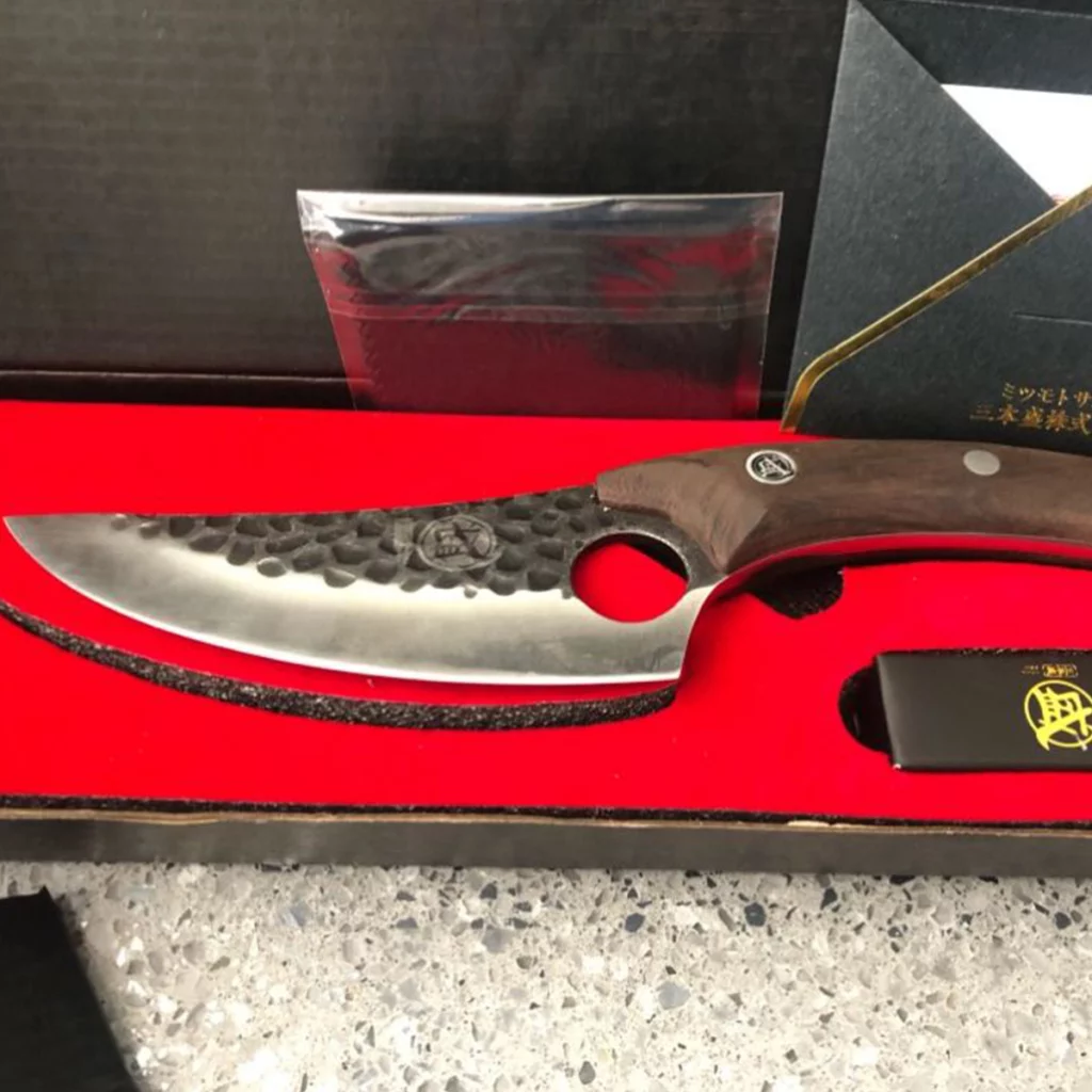 Huusk Knife in red case, showcasing its premium packaging
